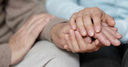 Caring hands held together in support